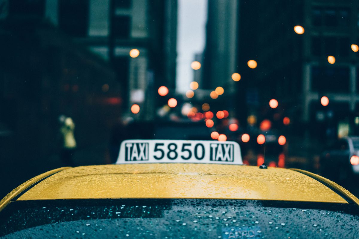 Close of Taxi cab in Chicago as it's raining