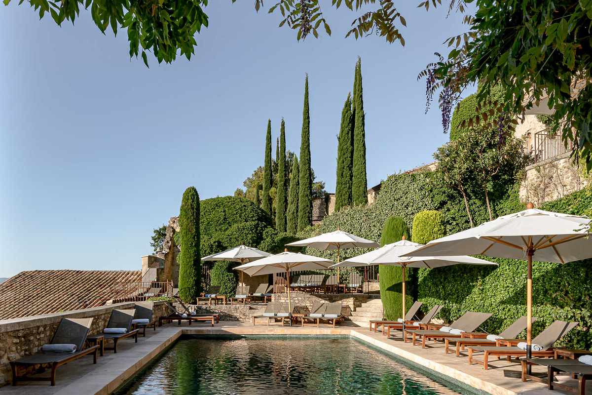 Pool and umbrellas at the Crillon le Brave resort in France, voted one of the best hotels in the world