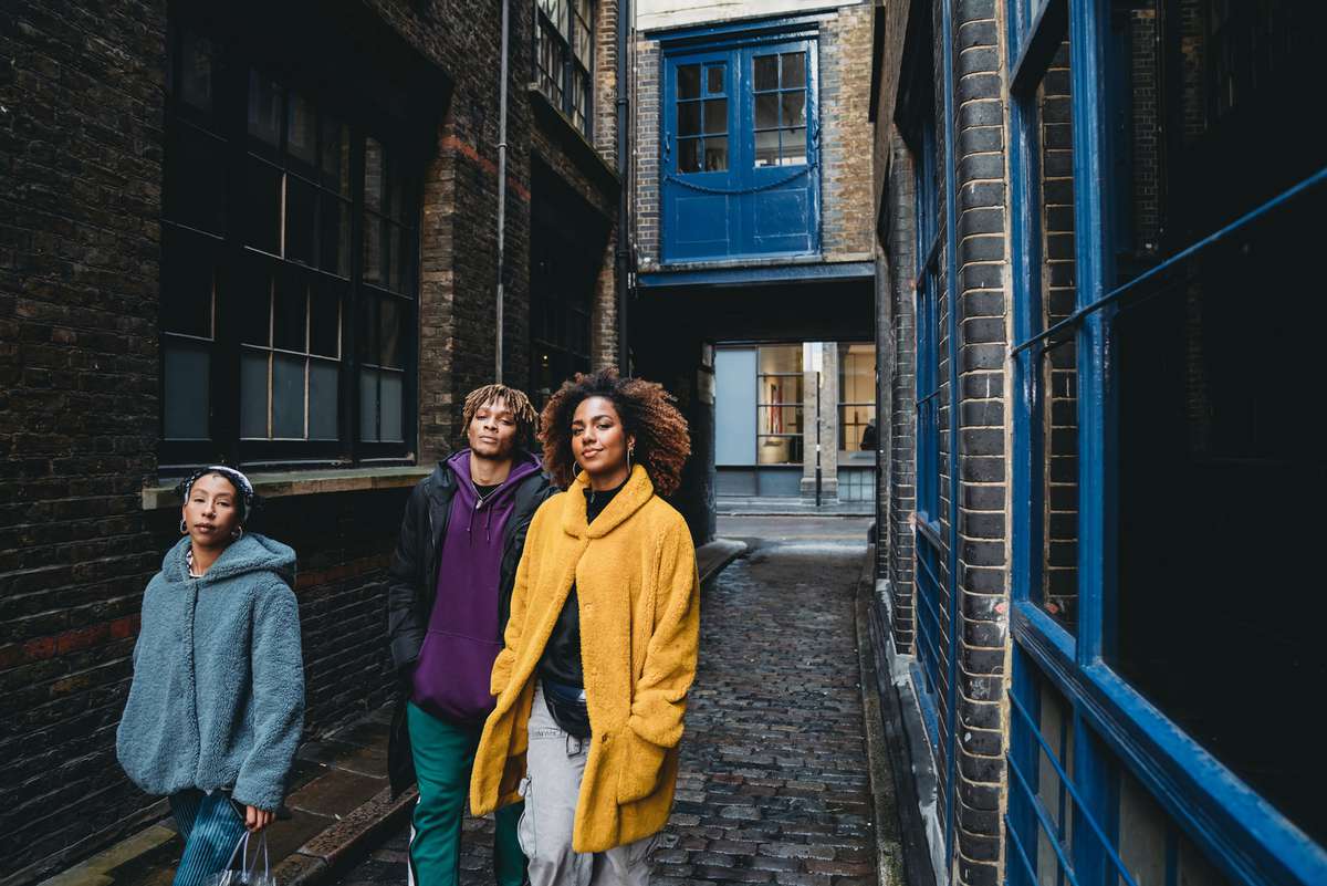 Three young people walking in Shoreditch, London