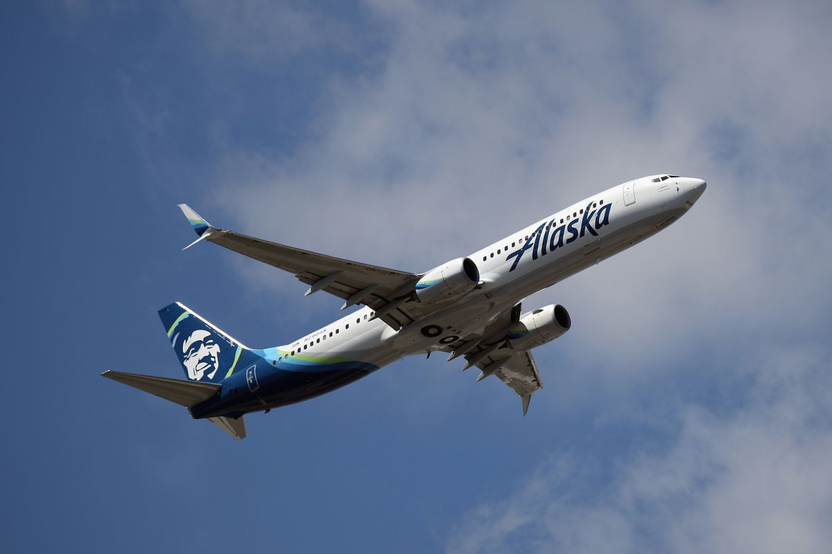 A Boeing 737-990 (ER) operated by Alaska Airlines takes off from JFK Airport