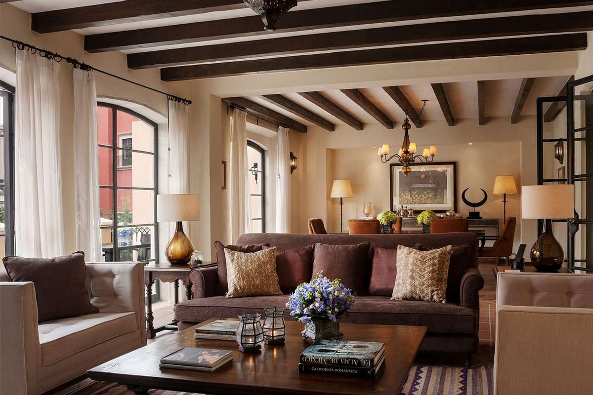 Luxury room with couches and dining table at Rosewood San Miguel de Allende