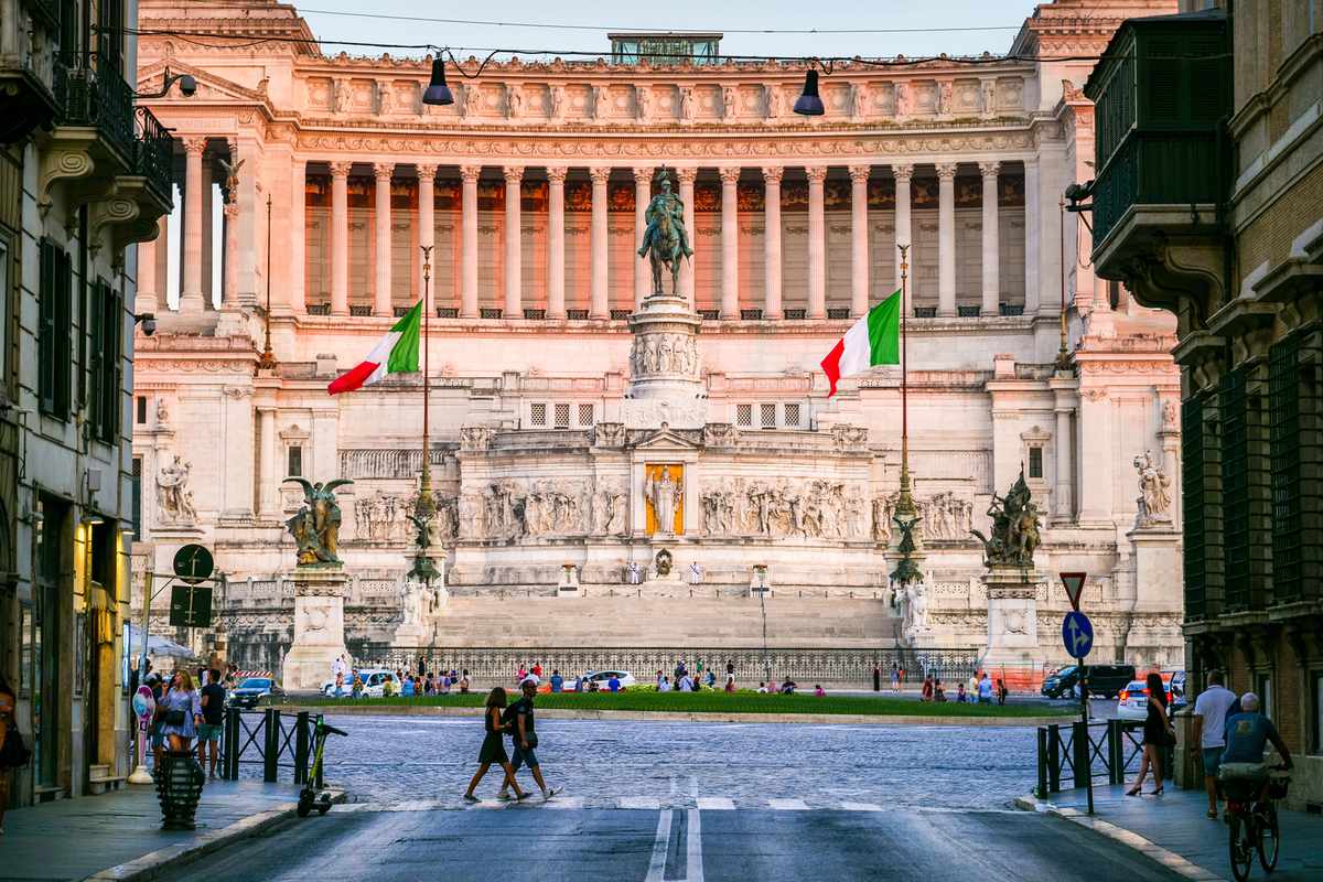 A stunning view of the National Monument of the Altare della Patria in Rome in the light of the sunset