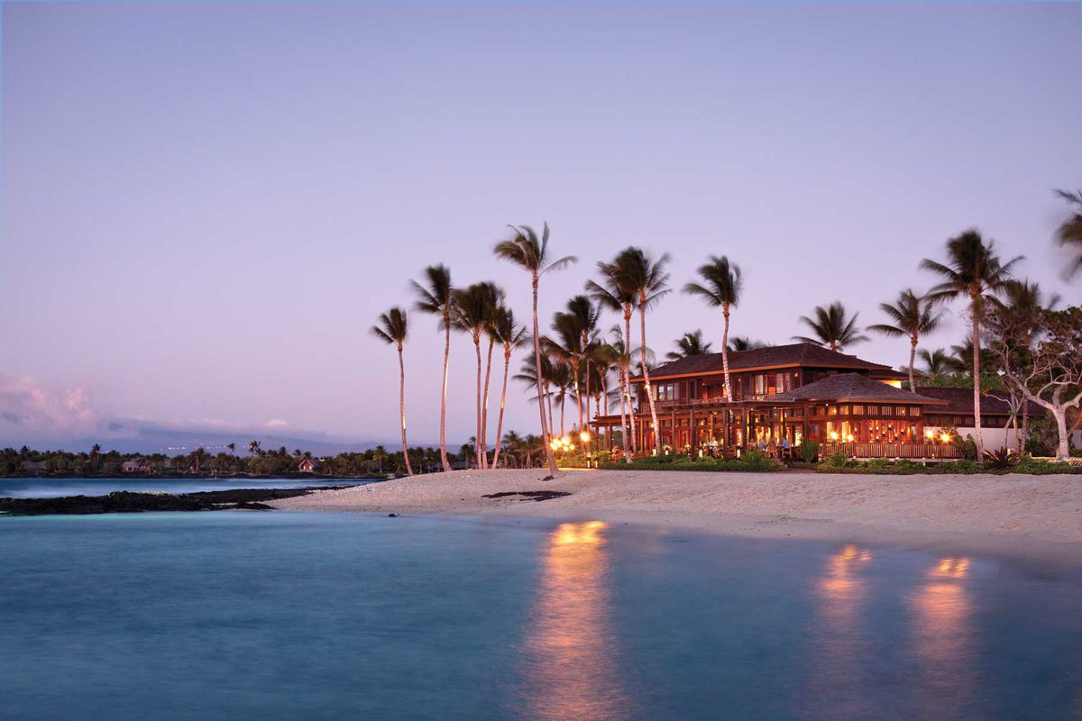 Dusk view of the Four Seasons Resort Hualalai, voted one of the best resorts and hotels in Hawaii