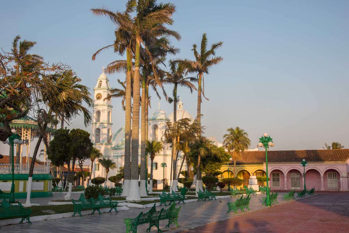 Colorful buildings surround the Zocalo town square in Tlacotalpan, Mexico.