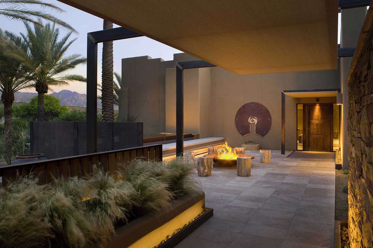 Spa entrance in the evening with a fire going at Miraval Arizona