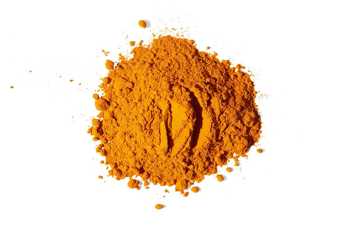 A pile of turmeric from Diaspora Co, photographed on white background