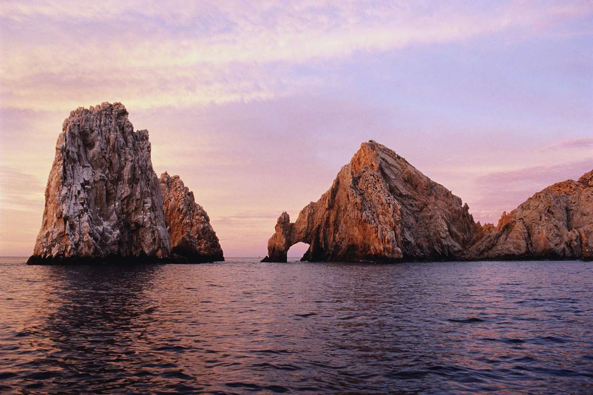 Mexico,Cabo San Lucas, The Arch rock formation in sea at dawn