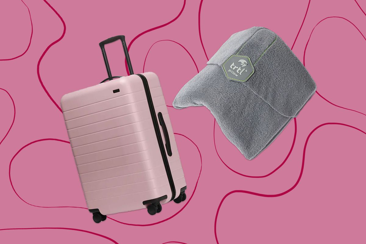 Pink suitcase and travel pillow