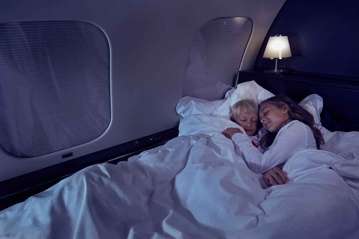 Kids sleeping on a VistaJet plane