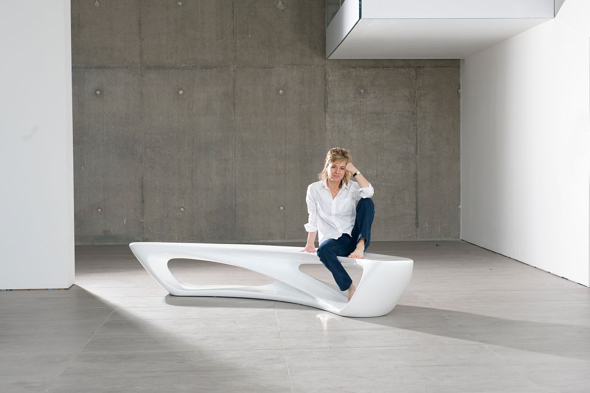Amanda Levete, architect, with Drift, a bench which she designed for Established & Sons. Photographed at Established & Sons.