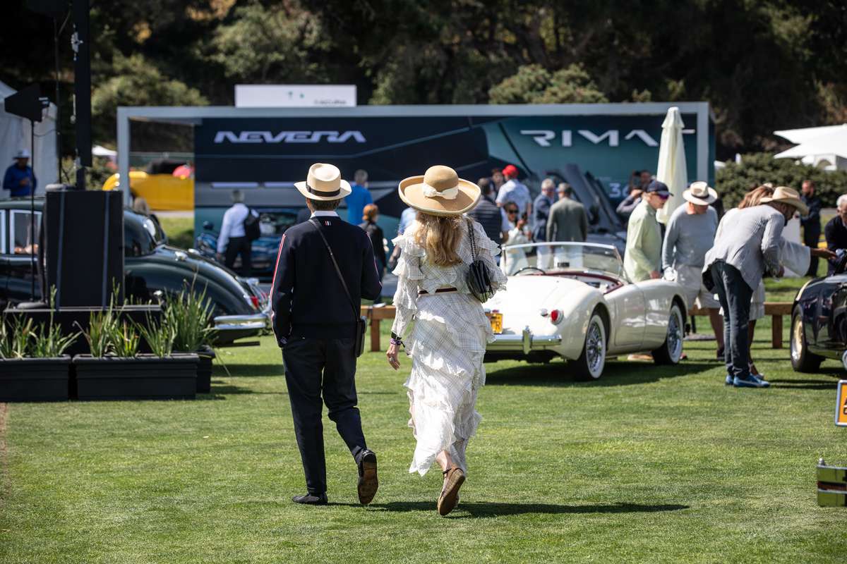 People walk around at The Quail, A Motorsports Gathering