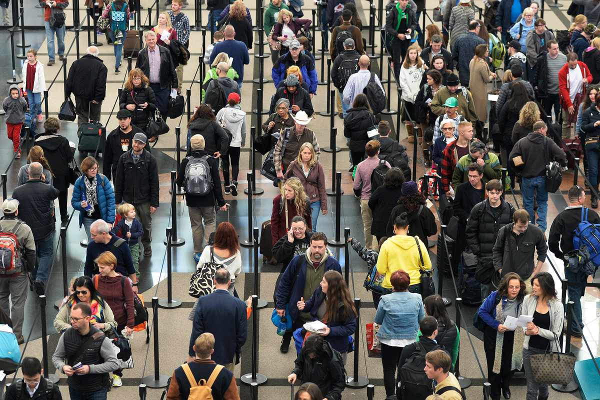Security lines at Denver International Airport are long but moving fast, November 26, 2014. The airport was busy with thanksgiving travelers.