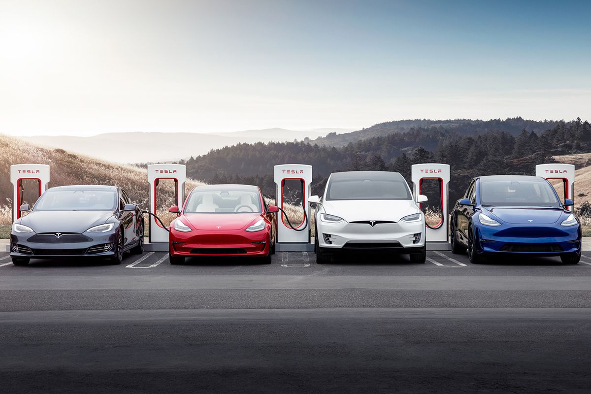 A group of Teslas at a charging station