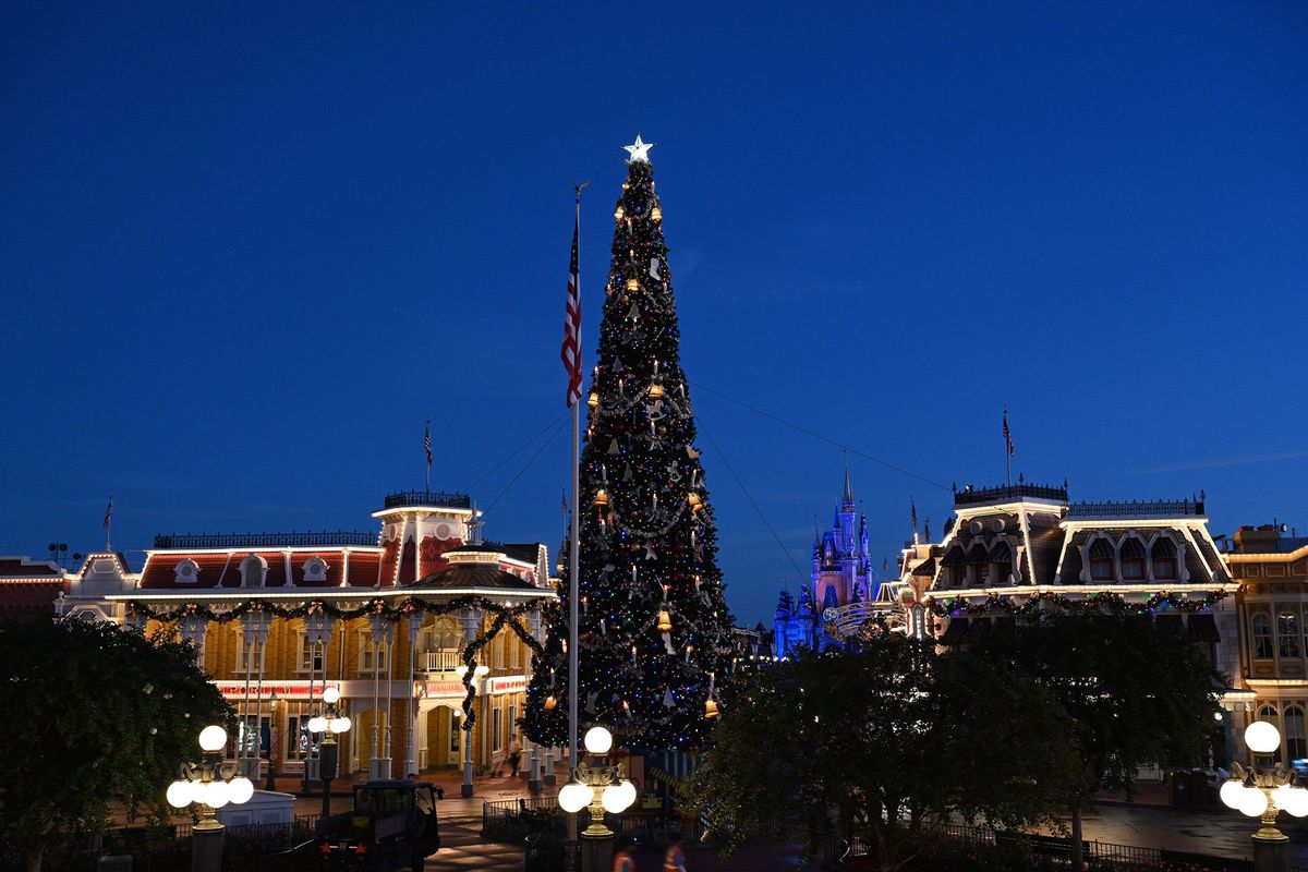 Halloween decor is taken down and replaced with holiday decorations all in one night along Disney's Main Street.