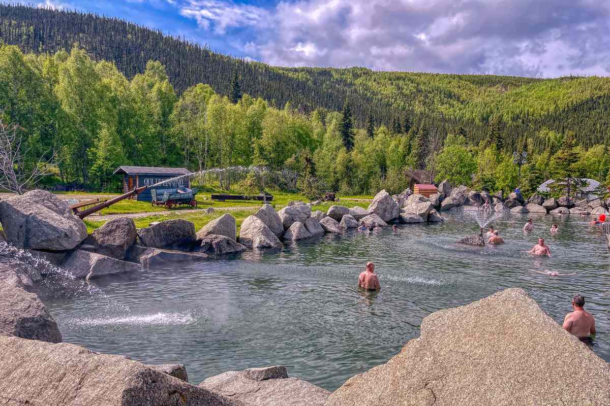 People relaxing in the Chena Hot Springs during summer