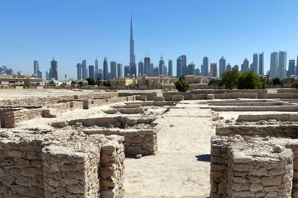 The remains of a ninth-century city at the Jumeirah Archaeological Site, with the Dubai skyline beyond