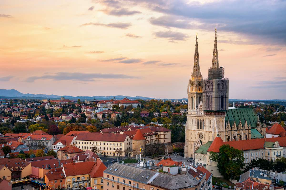 The beautiful church in Zagreb with the old buildings in old city among the sunrise in Croatia, Europe.