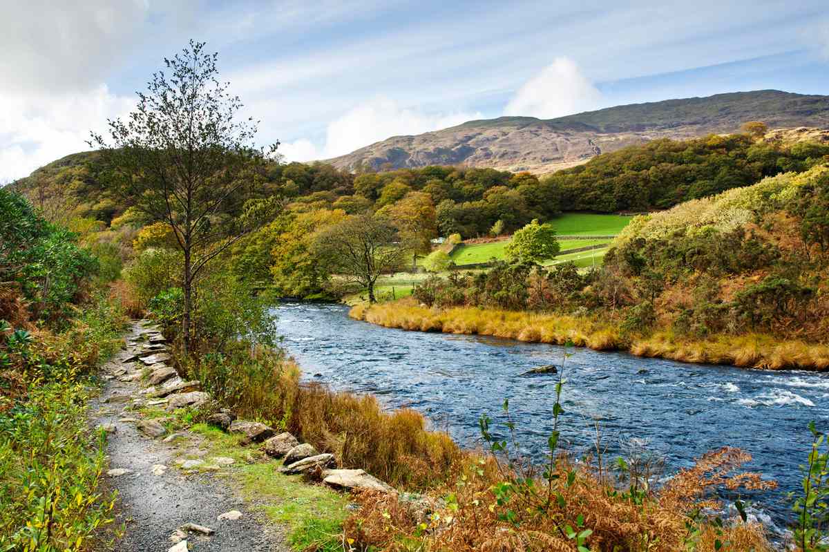 River Glaslyn (Afon Glaslyn) flows out of Llyn Dinas in autumn Snowdonia National Park