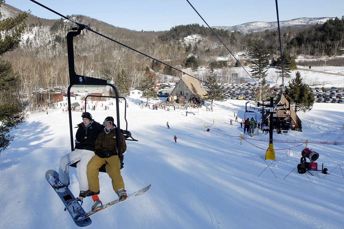 Snowboarders make their way up the lift at the Camden Snow Bowl on Jan. 9. The Snow Bowl is a very popular community-owned ski and recreation area.