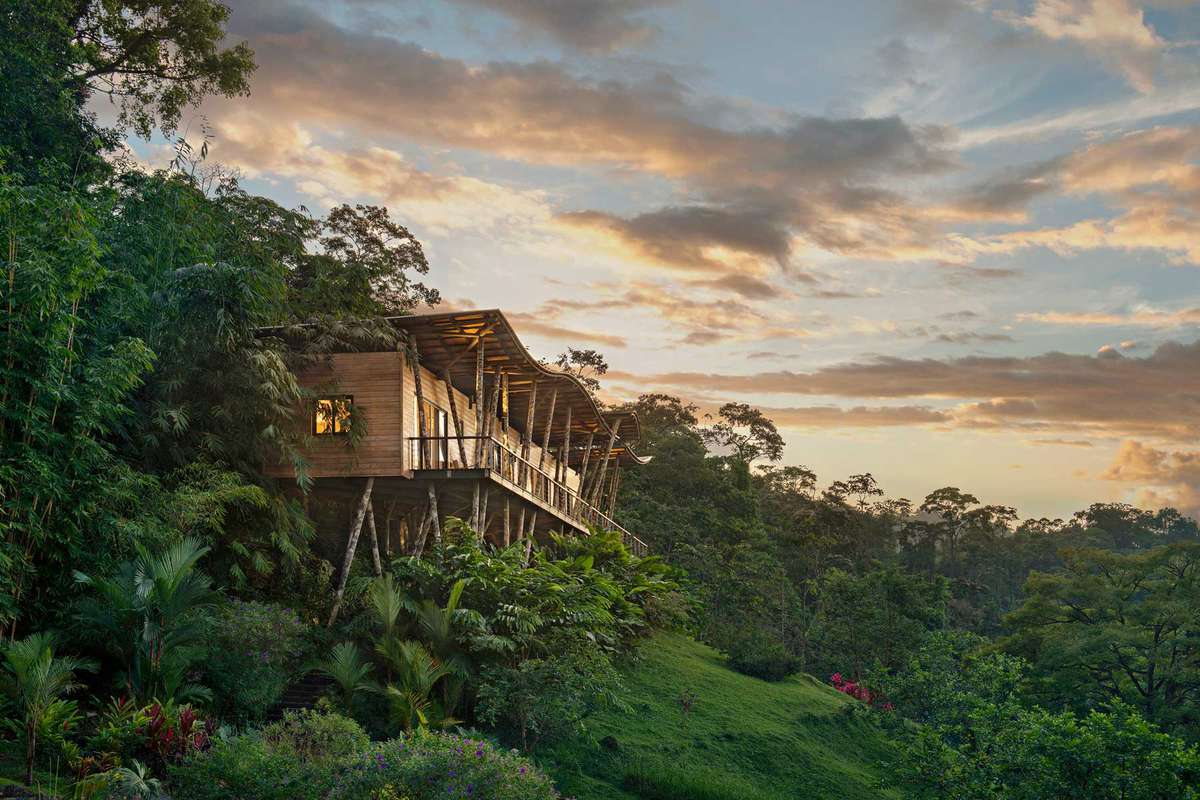 Exterior of a villa perched on a hill in a rainforest in Costa Rica