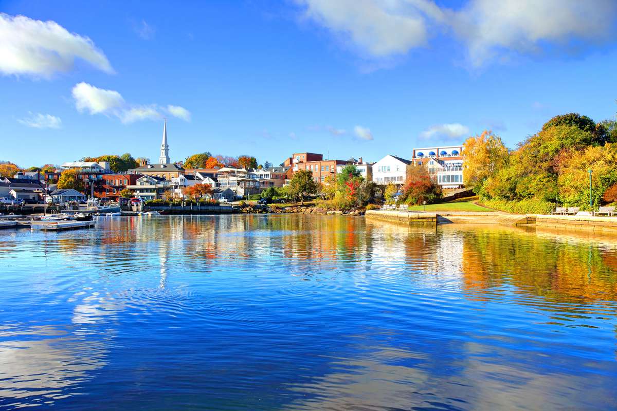 Camden, Maine during autumn as seen from blue waters on a sunny day