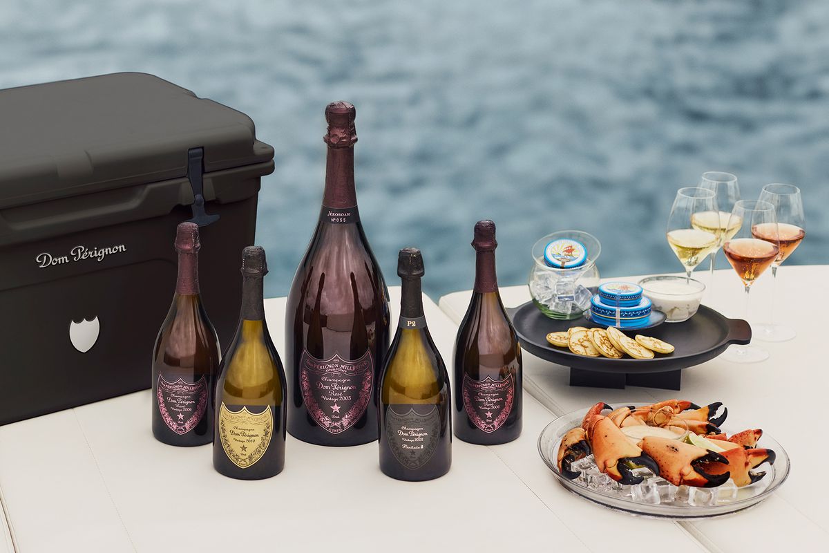 Bottles of Dom Perignon and selfish from the Dom Perignon Yacht Concierge