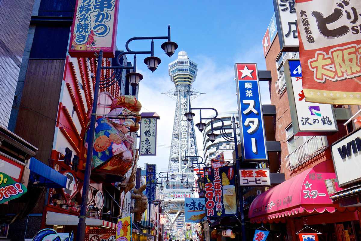 Color signs and Tsutenkaku Tower in south Osaka