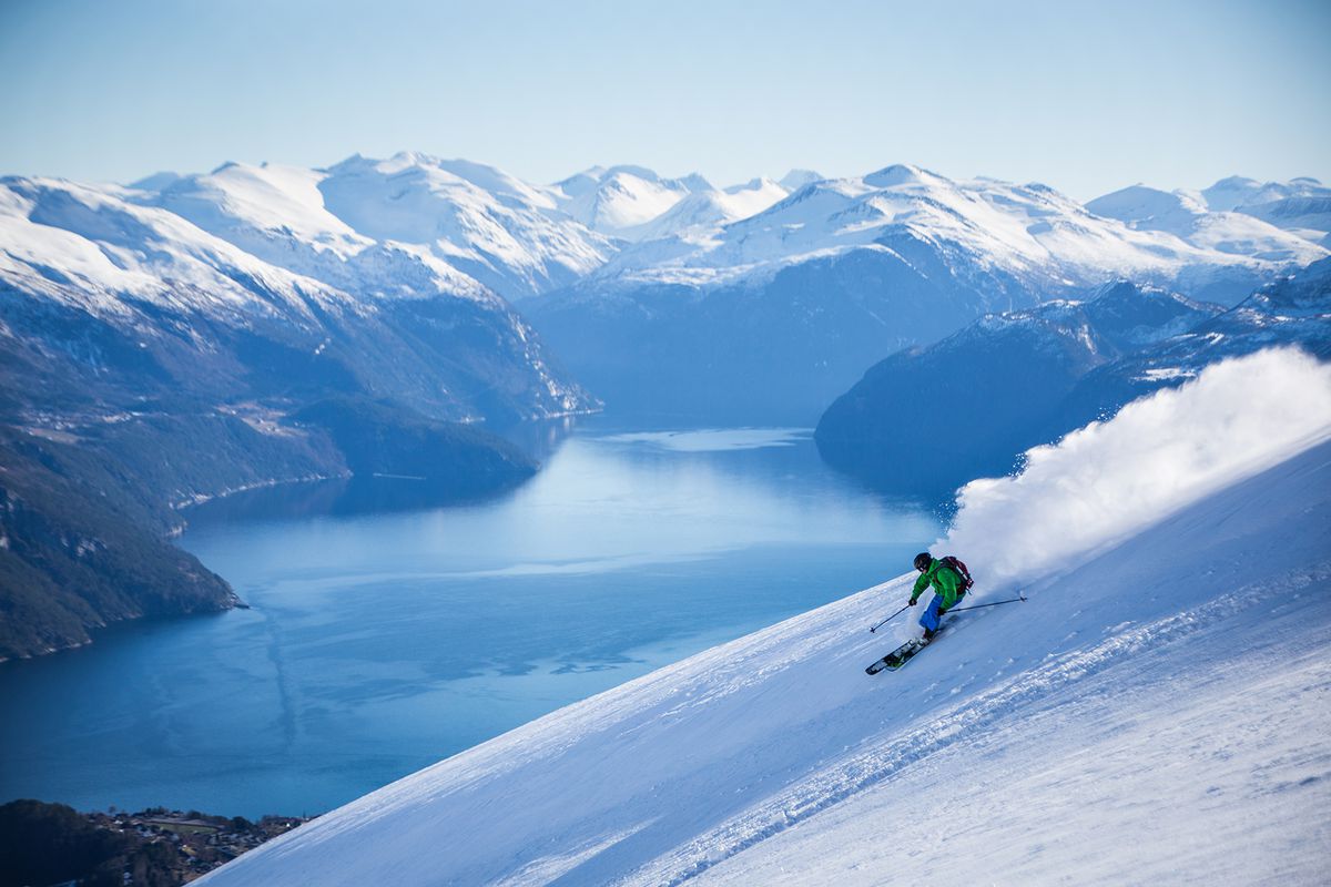 A skier going down a mountain in Norway