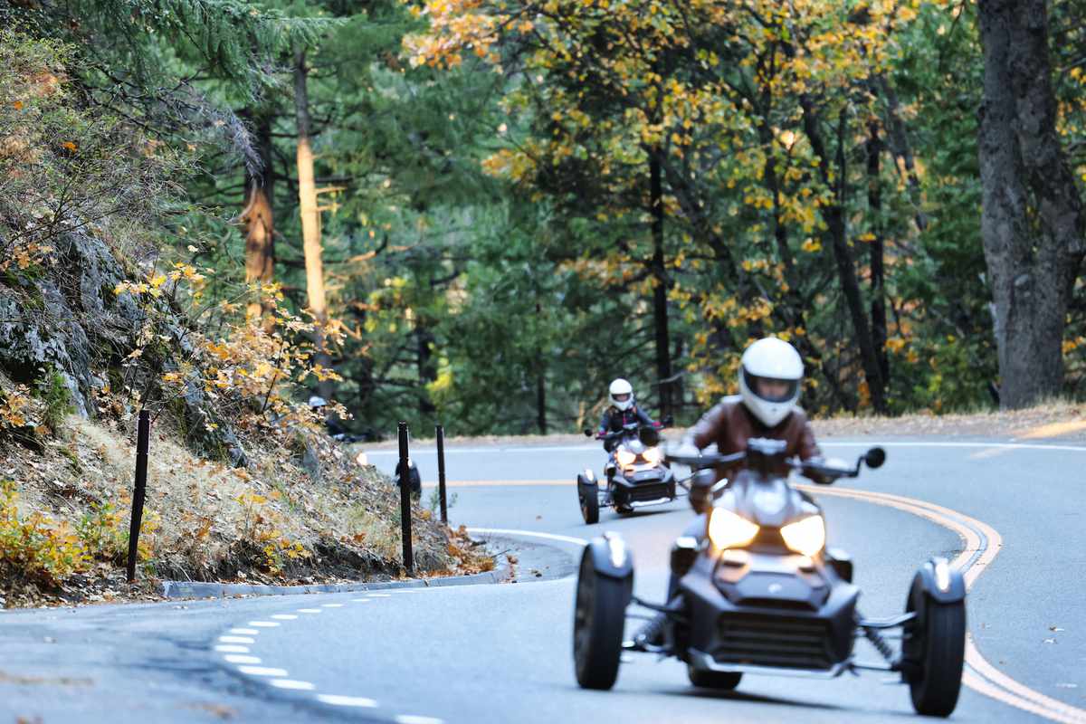 Two women on Can-Am motorcycles through Yosemite National Park