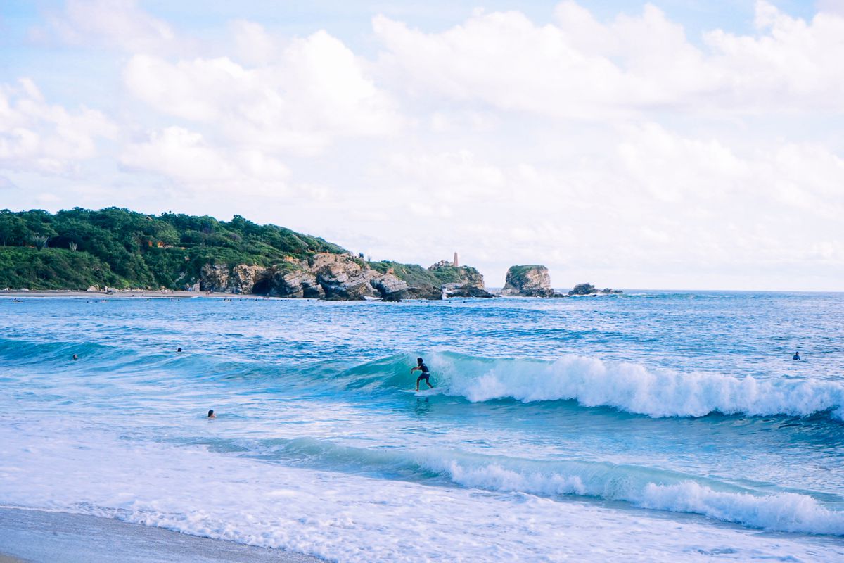 Surfers in the water at Puerto Escondido