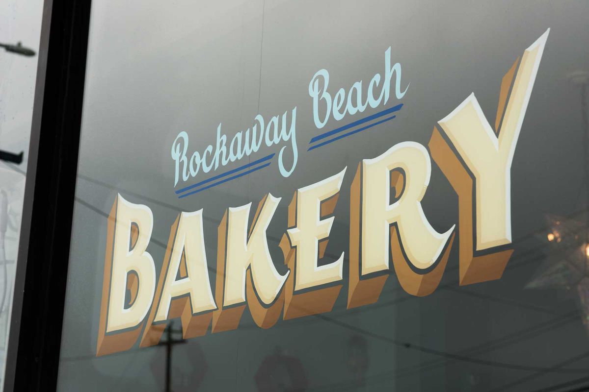Rockaway Beach Bakery sign painted on the bakery's window