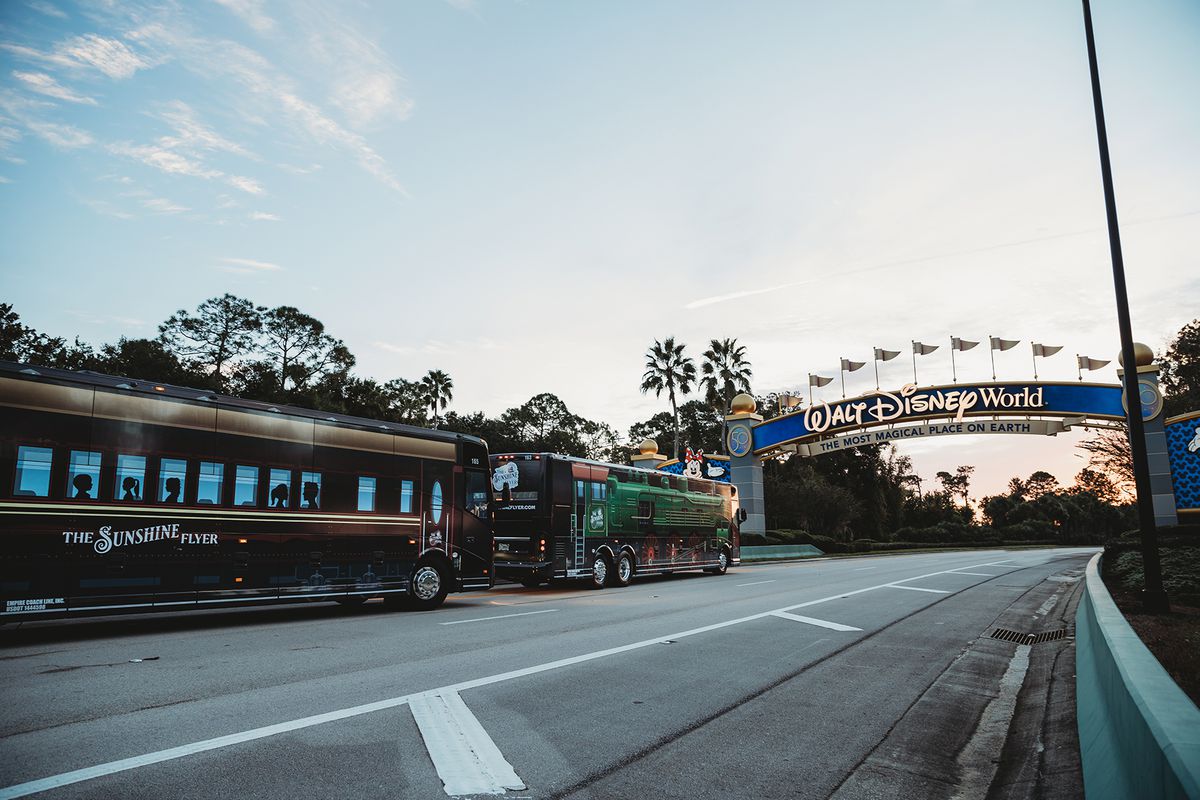 Sunshine Flyer Bus Company drives toward Walt Disney World Entrance