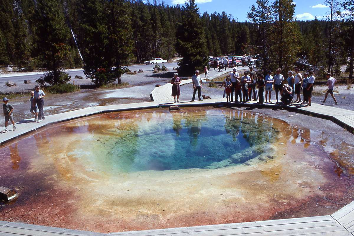 Visitors stand around a prismatic spring, year unknown
