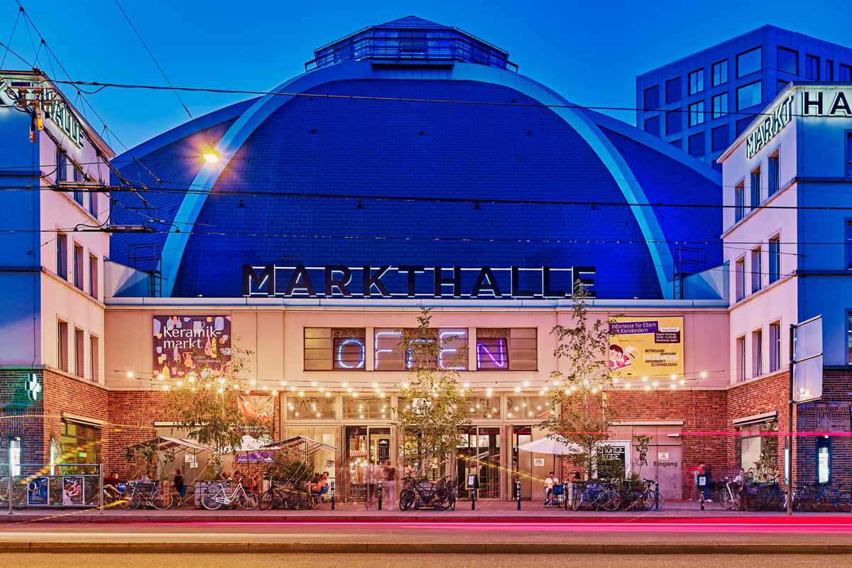 Exterior of the Markthalle in Basel, lit up at night