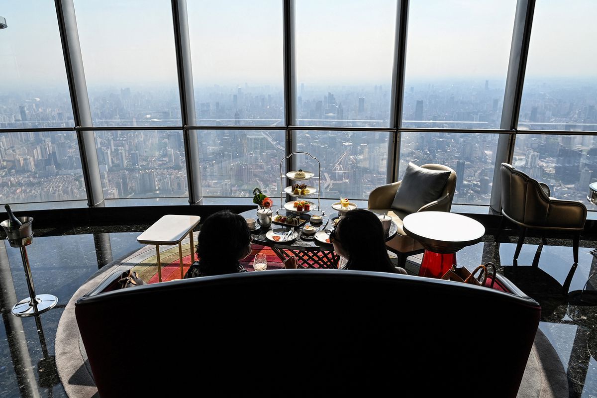 Guests are seen in the J Hotel, the world's highest luxury hotel, boasting a restaurant on the 120th floor and 24-hour personal butler service, located in the Shanghai Tower, in Shanghai