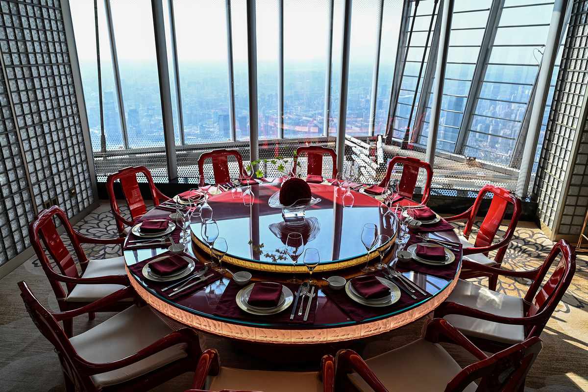 A table is seen in the restaurant of the J Hotel, the world's highest luxury hotel, boasting a restaurant on the 120th floor and 24-hour personal butler service, located in the Shanghai Tower, in Shanghai