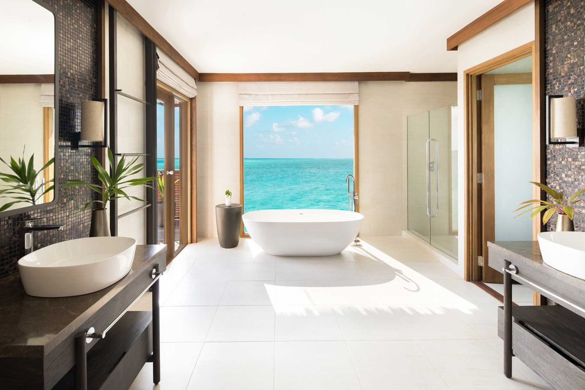 Conrad Maldives's overwater villas, with luxury bathrooms and bedrooms