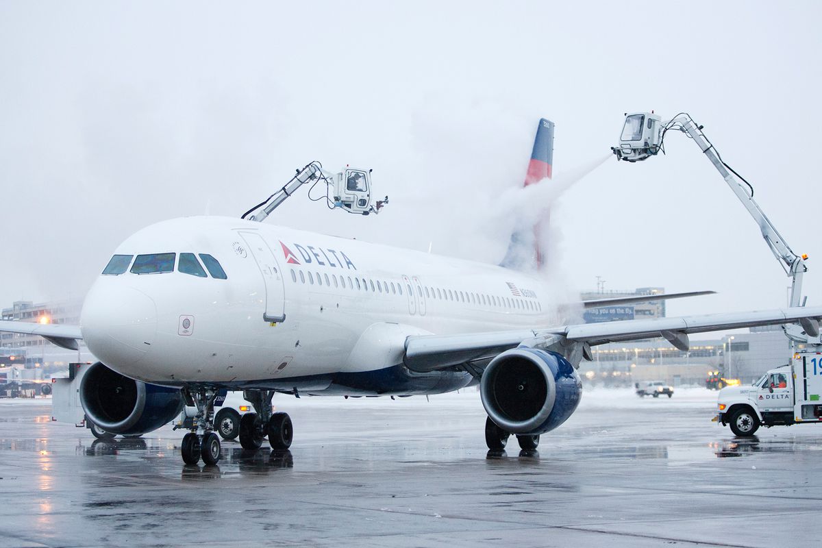 A Delta Air Lines plane prepping for upcoming storms