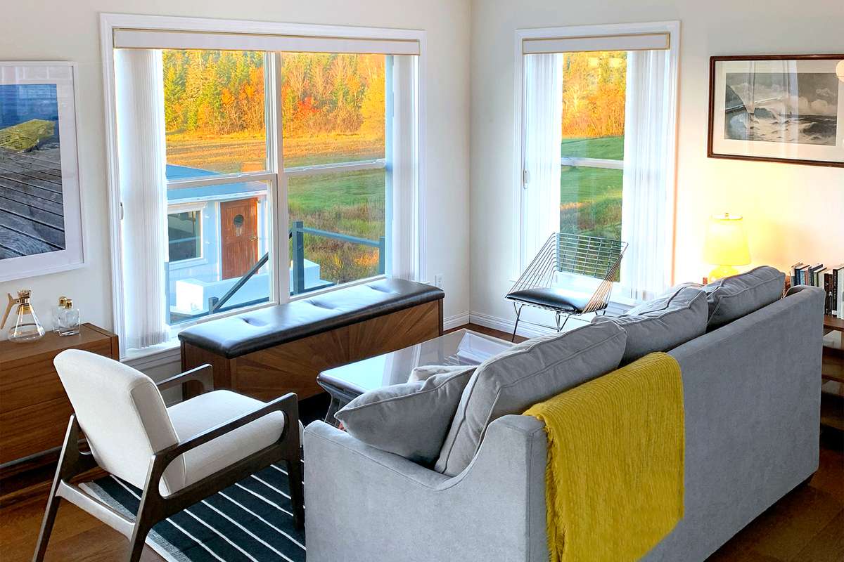 The light-filled living room overlooks the lobster boat and beautiful Holmes Bay