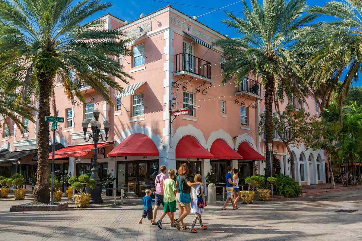 Family walks down Española Way, Miami Beach, Florida during the day