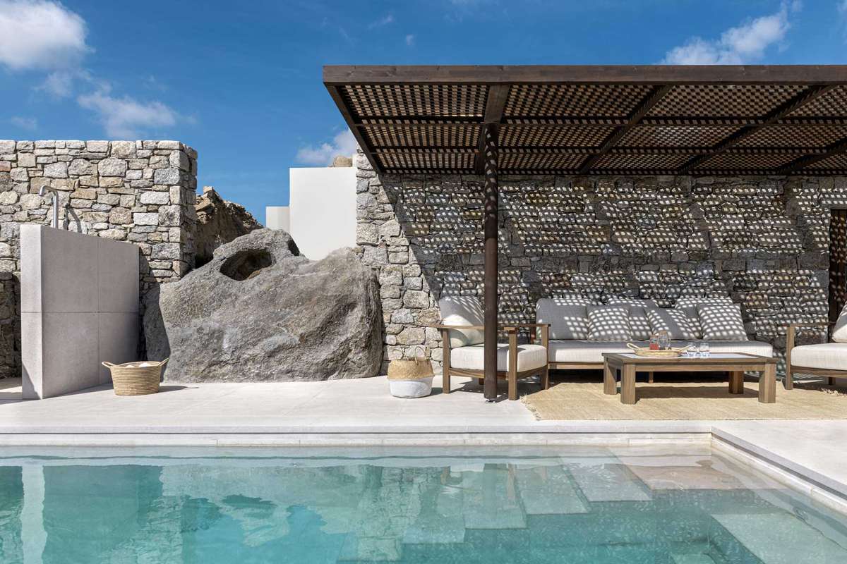 Cali Mykonos interiors and pool with a view of the ocean