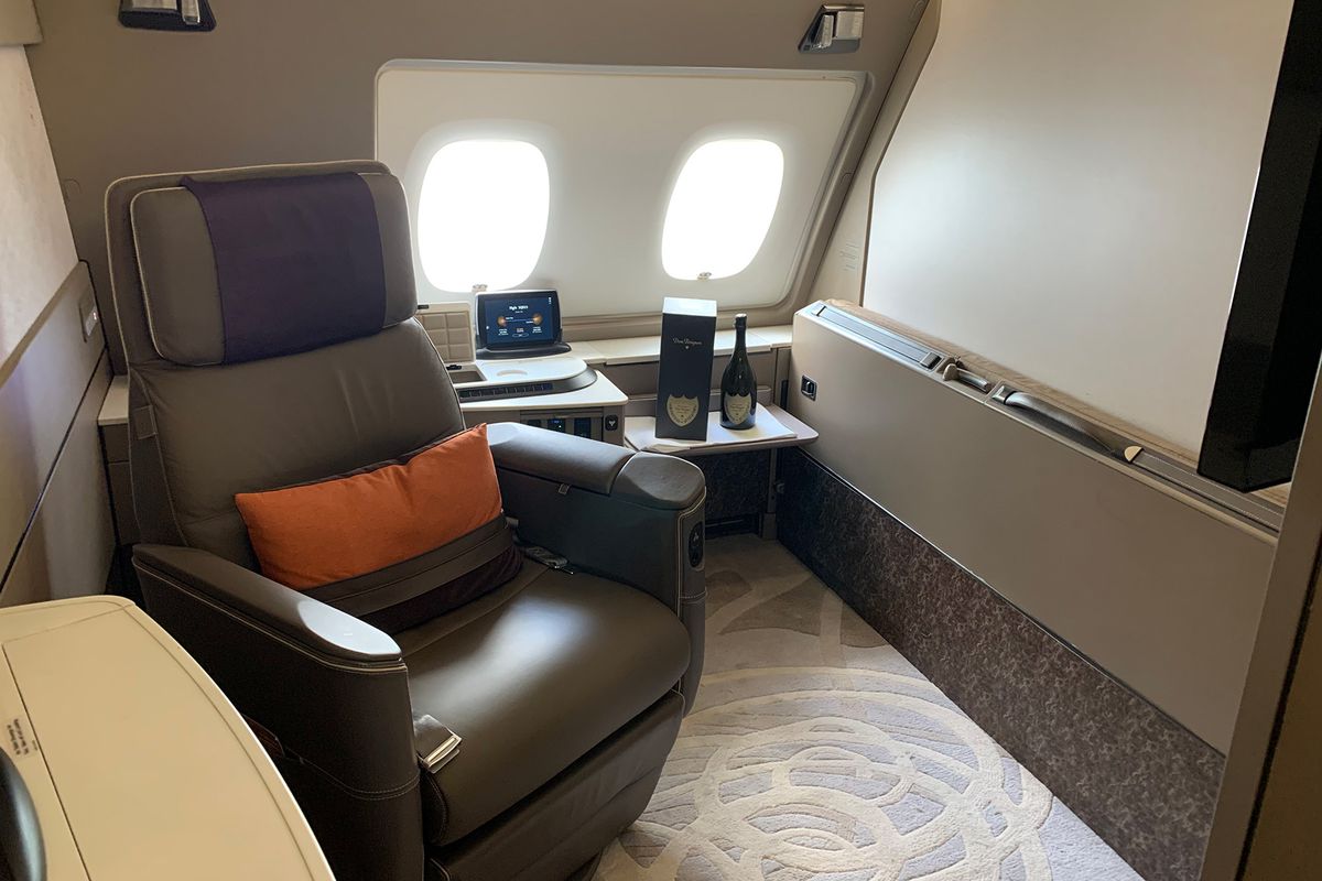 A chair and bottle of champagne from the Singapore Airlines A380 First Class Suite