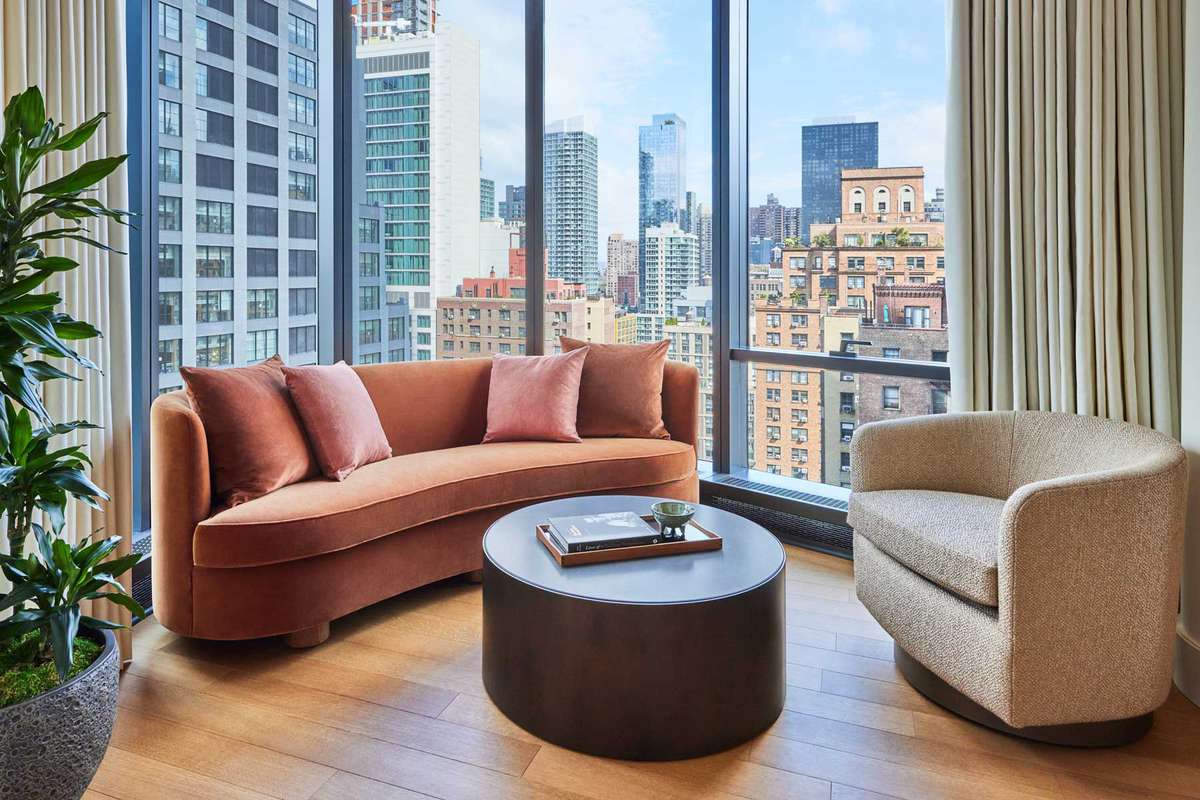 Interior seating with view of New York City at Pendry Manhattan West