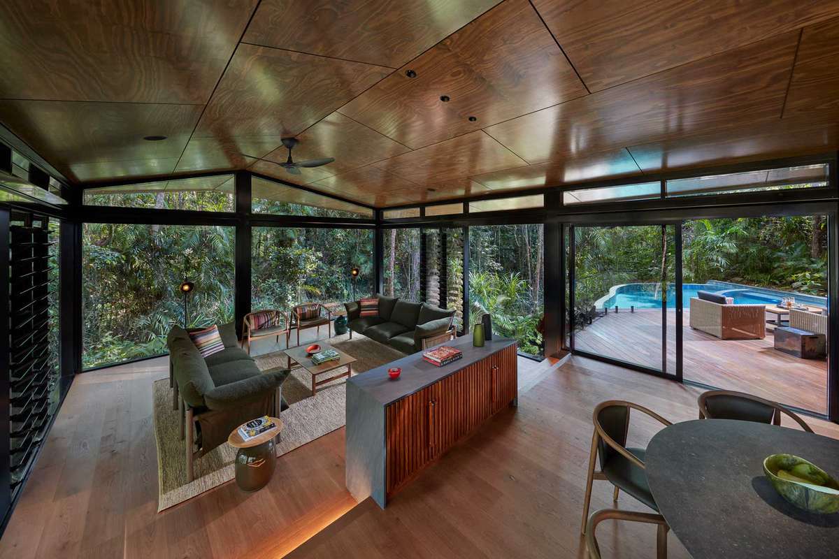 Interior view with floor to ceiling windows at Silky Oaks Lodge in Daintree Forest, Australia