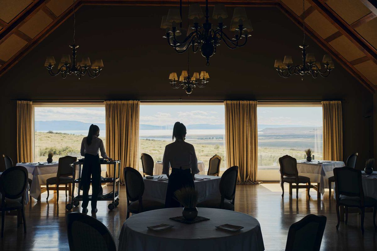 Waiters preparing the dining room at a hotel in remote Argentina