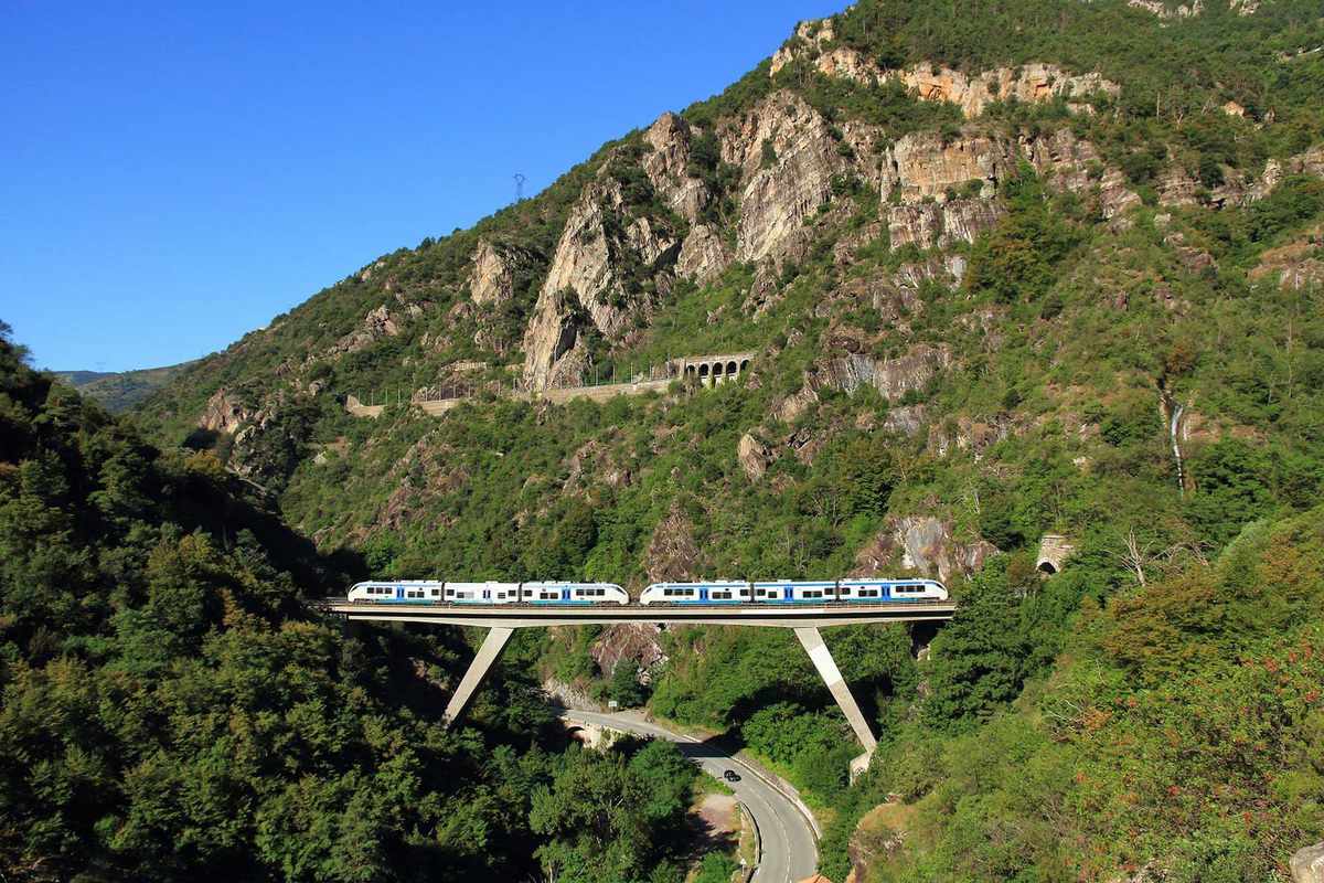 Italian trains in beautiful mountainous landscapes