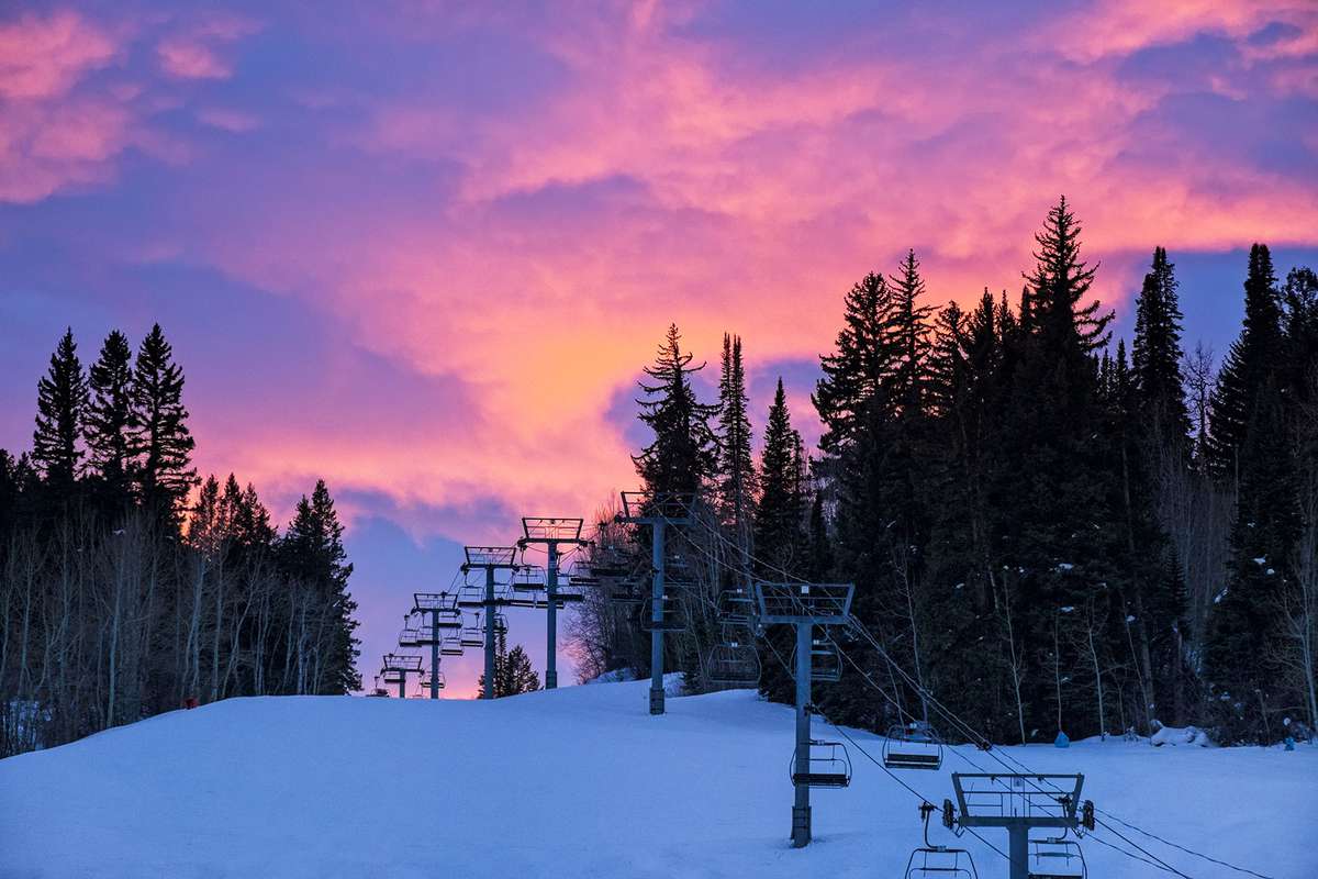 Ski Runs Silhouetted at Sunset with Dramatic Pink Clouds on Buttermilk Mt.