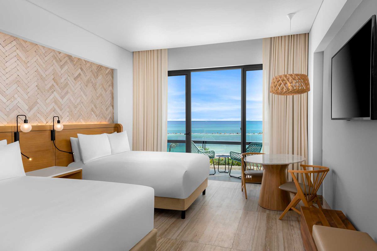 Guest room beds at Hilton Tulum
