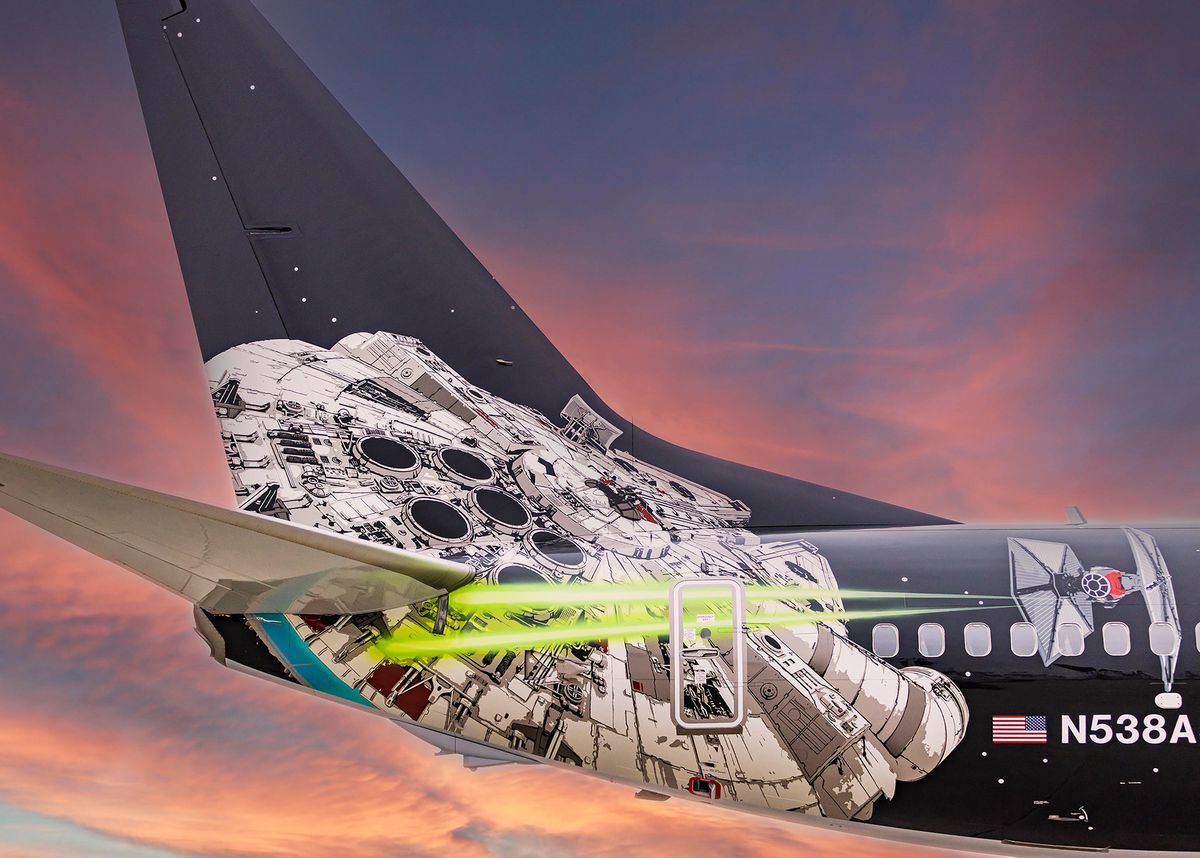 Tail of an Alaska Airlines plane painted with Star Wars ships