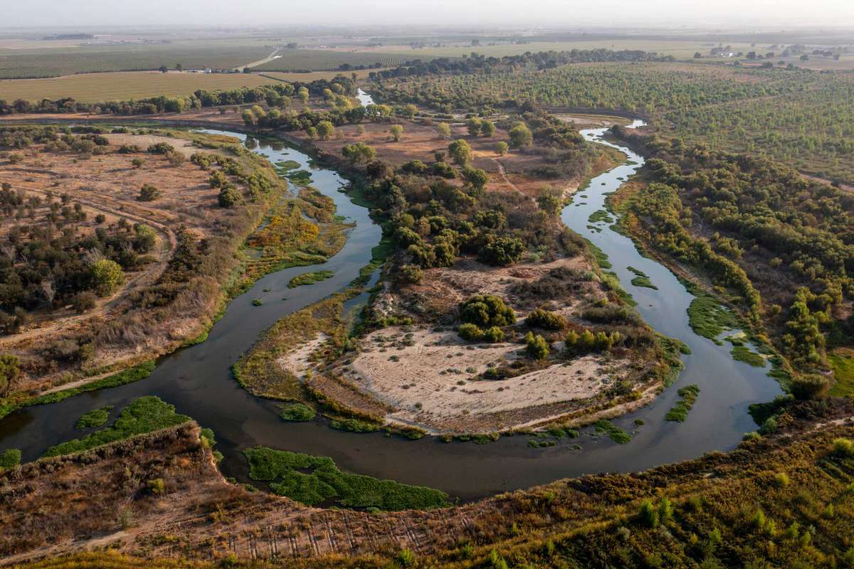 The confluence of the San Joaquin River, left, and Tuolumne River, right, along the Dos Rios Ranch Tuesday, Sept. 21, 2021 in Modesto, CA.